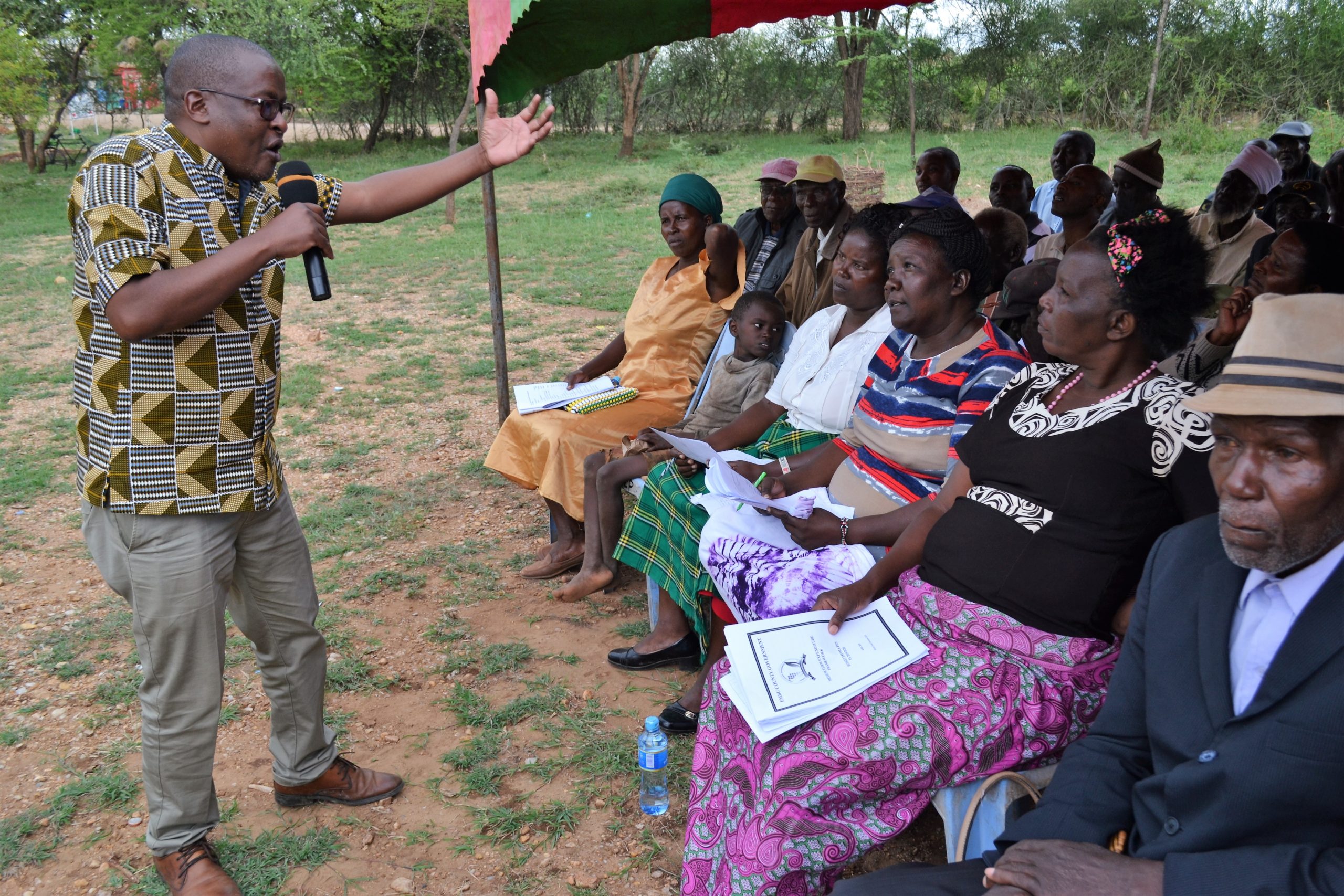 /Budget-and-Appropriations-Committee-Chairman-Harrison-Mwaluko-Mwea-MCA-explaining-the-2019-2020-Budget-to-Makima-Residents-during-a-Public-Participation-forum.